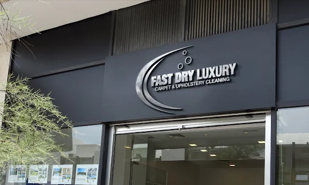 Fast Dry Luxury Carpet & Upholstery Cleaning sign above the shop entrance in Helena, Montana