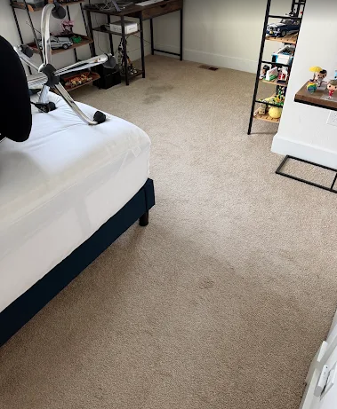 Spotless beige bedroom carpet after cleaning and protector application