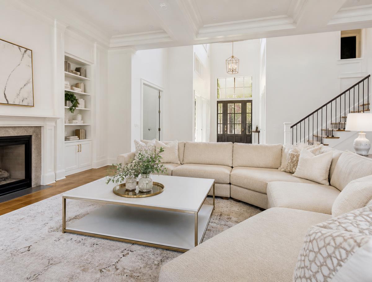 Freshly cleaned cream sectional sofa in a bright luxury living room